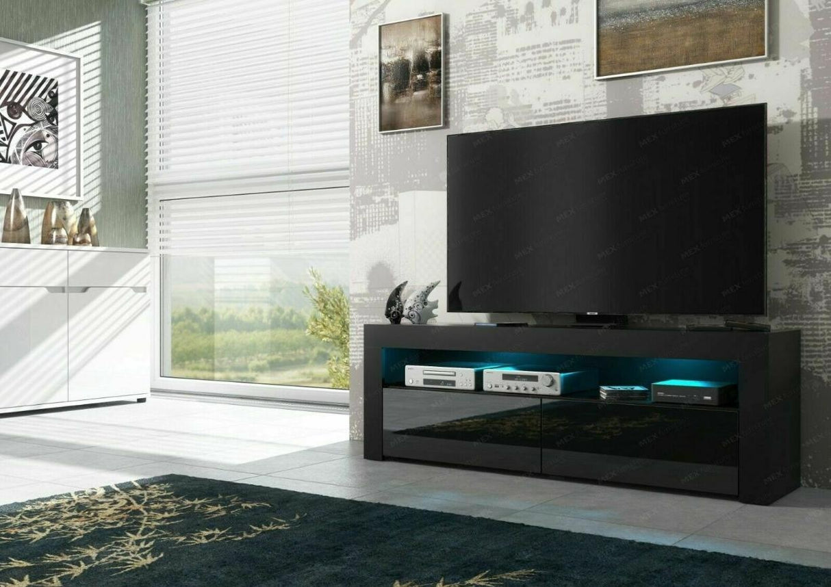 TV STAND DACO 2 BLACK GLOSS FRONTS 140CMDepth: 40 cmWidth: 140 cmHeight: 45 cmMinimalist designThe cabinet has 2 functional and roomy storage compartments.The furniture has high gloss lacquered fronts and the body of the furniture is matt.A modern RTV tab