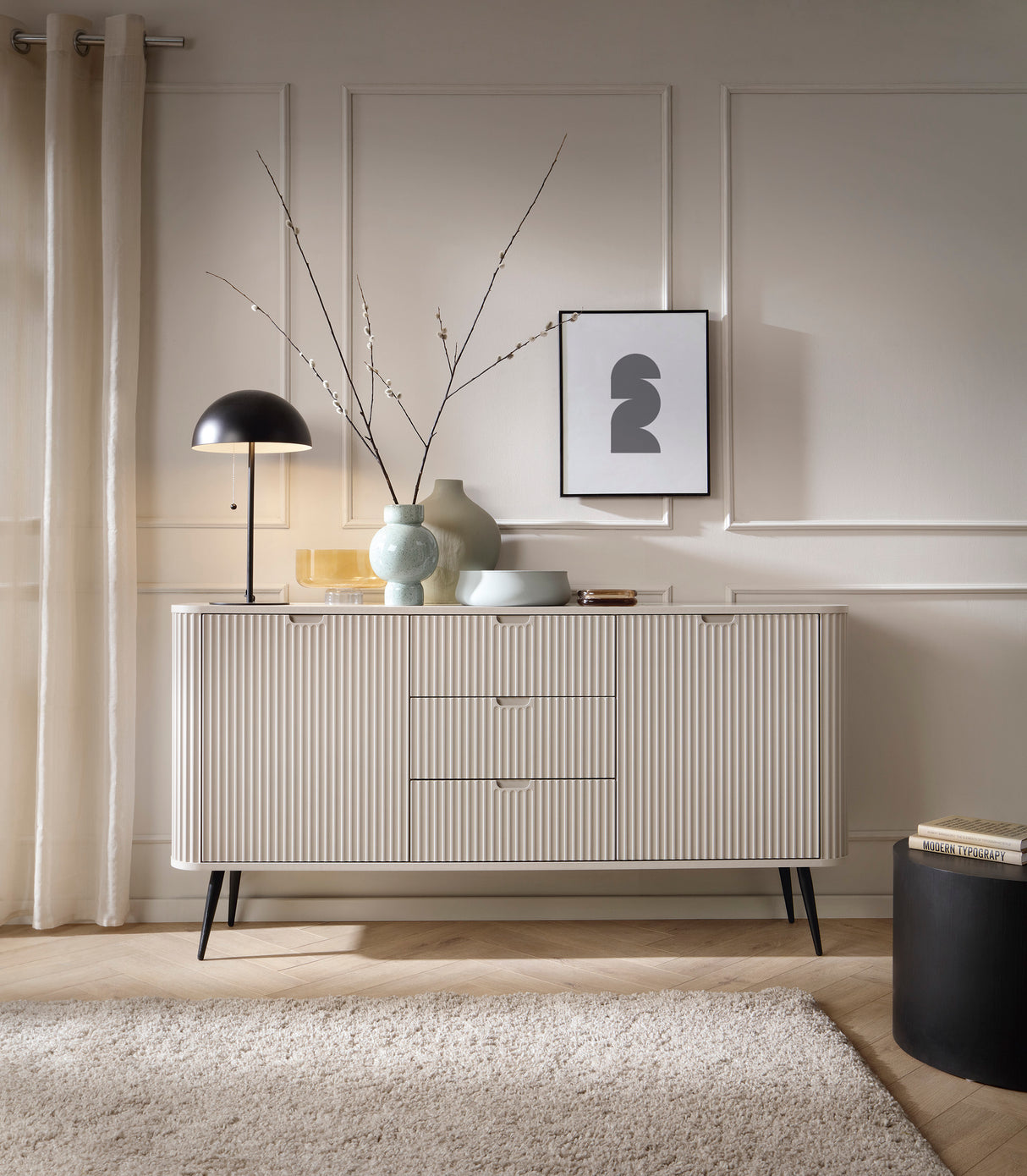 Storage cabinet ZOVA 02 CASHMEREProduct description Dimensions Width 103cm Height 129cm Depth 39cm Details Colour cashmere Material Laminated board 18mm / MDF-board 18mm Veneer ABS edges Legs Metal, in black (23cm) Warranty 24 monthsUncategorizedAnna Furn