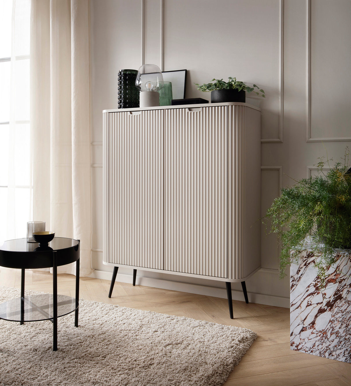 Storage cabinet ZOVA 03 CASHEMEREProduct description Dimensions Width 103cm Height 129cm Depth 39cm Details Colour cashmere Material Laminated board 18mm / MDF-board 18mm Veneer ABS edges Legs Metal, in black (23cm) Warranty 24 monthsUncategorizedAnna Fur
